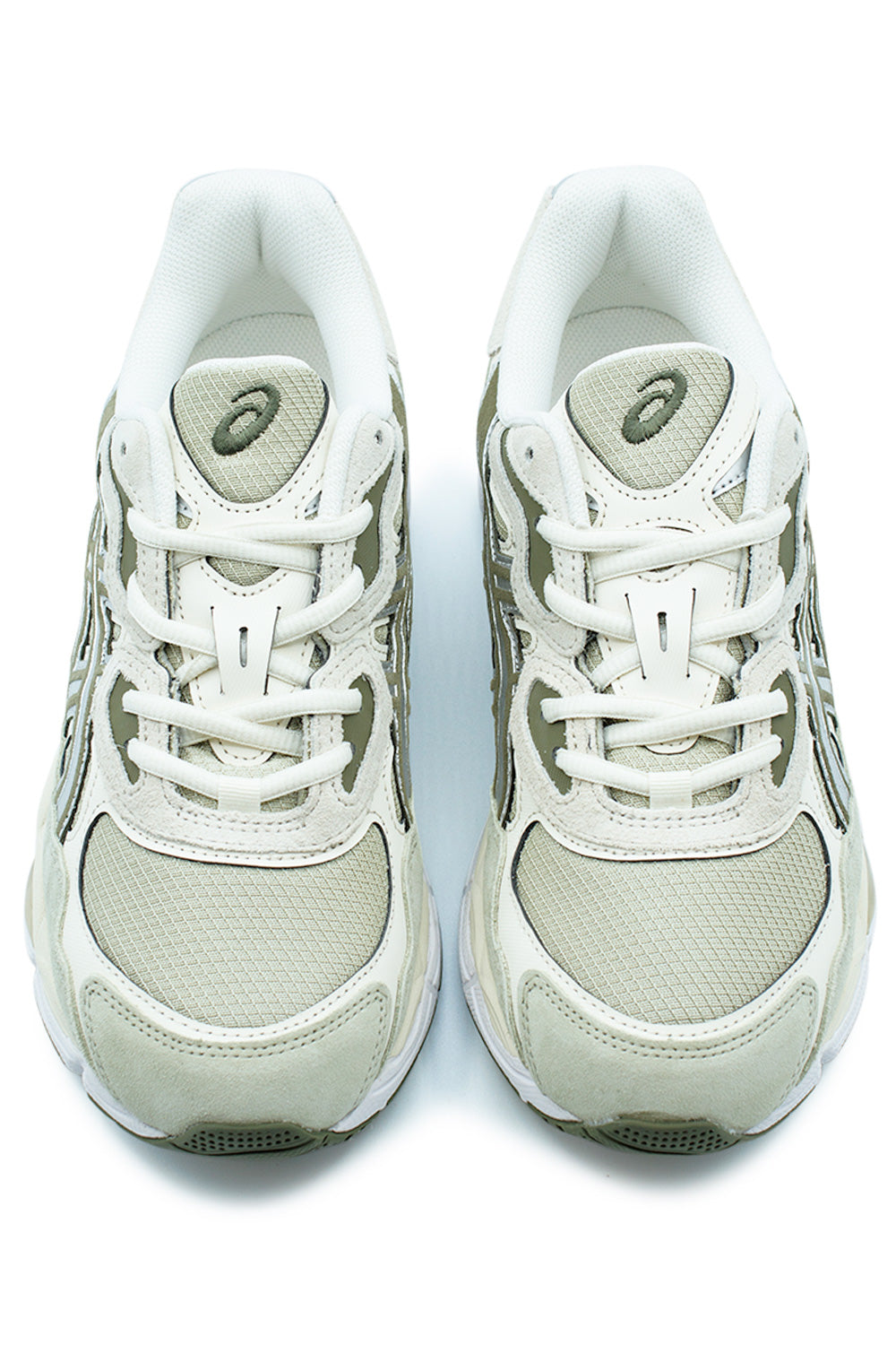 Top-down view of a pair of Asics GEL-NYC Khaki and Pure Silver sneakers, highlighting the white laces, detailed mesh toe box, and embroidered Asics tongue logo.