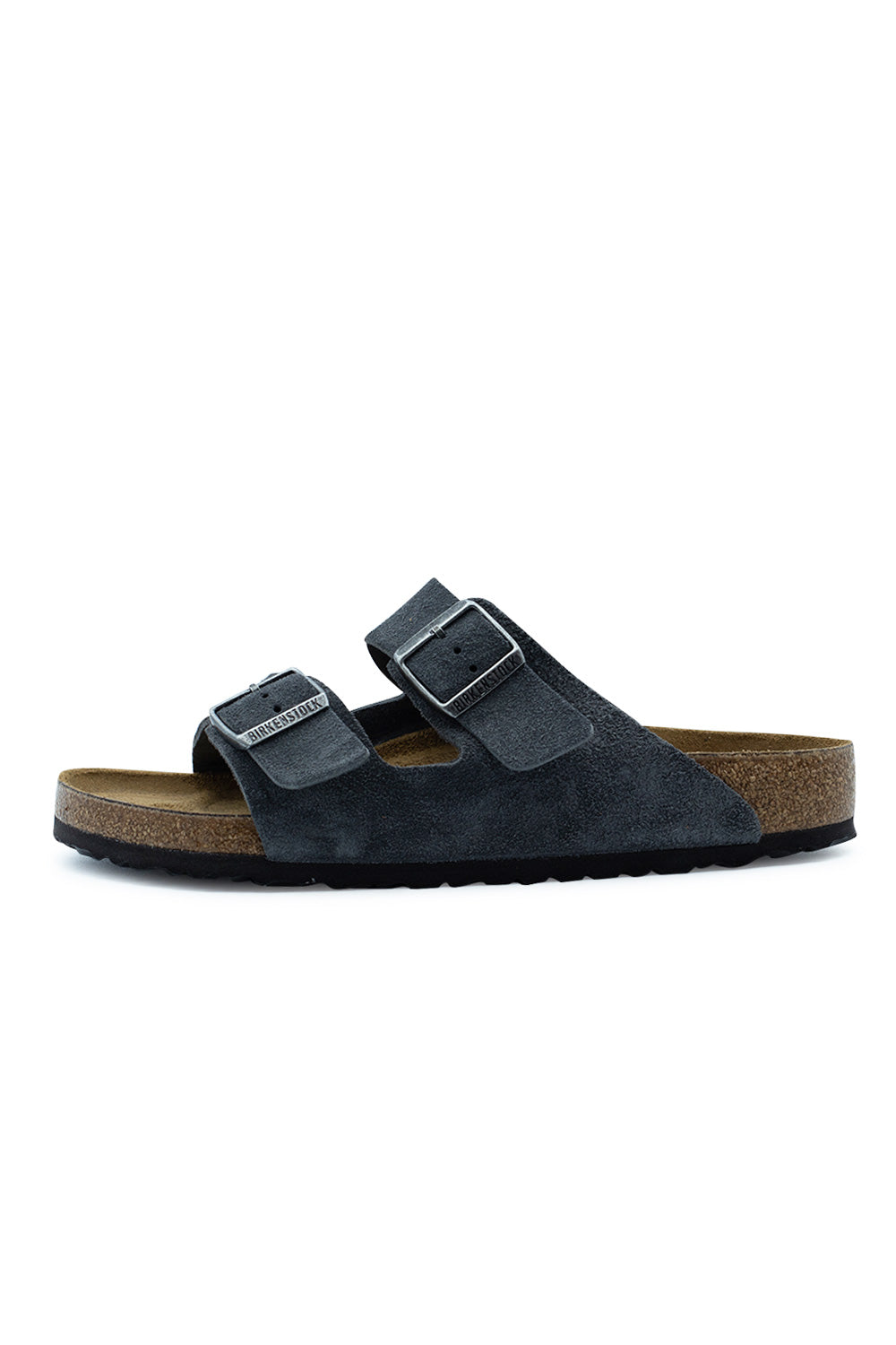 Lateral side profile view of the Birkenstock Arizona BS sandal in Charcoal suede, featuring two wide adjustable suede straps with matte grey metal pin buckles, a classic cork-latex midsole layer, and a black EVA tread outsole.