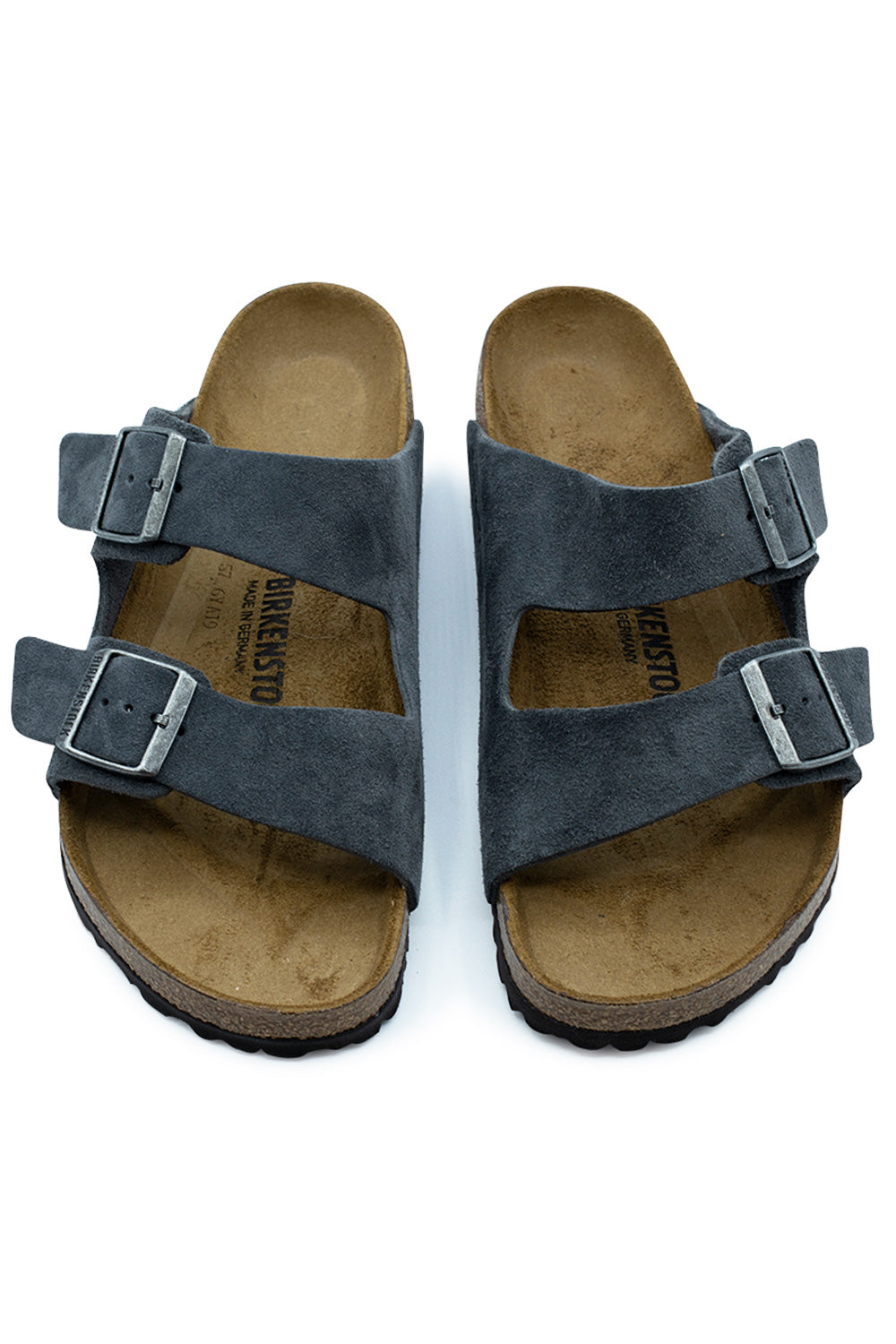 Top-down view of a pair of Birkenstock Arizona BS sandals in Charcoal, highlighting the dark grey suede two-strap design, adjustable metal buckles, and contoured suede-lined insoles with black BIRKENSTOCK branding.