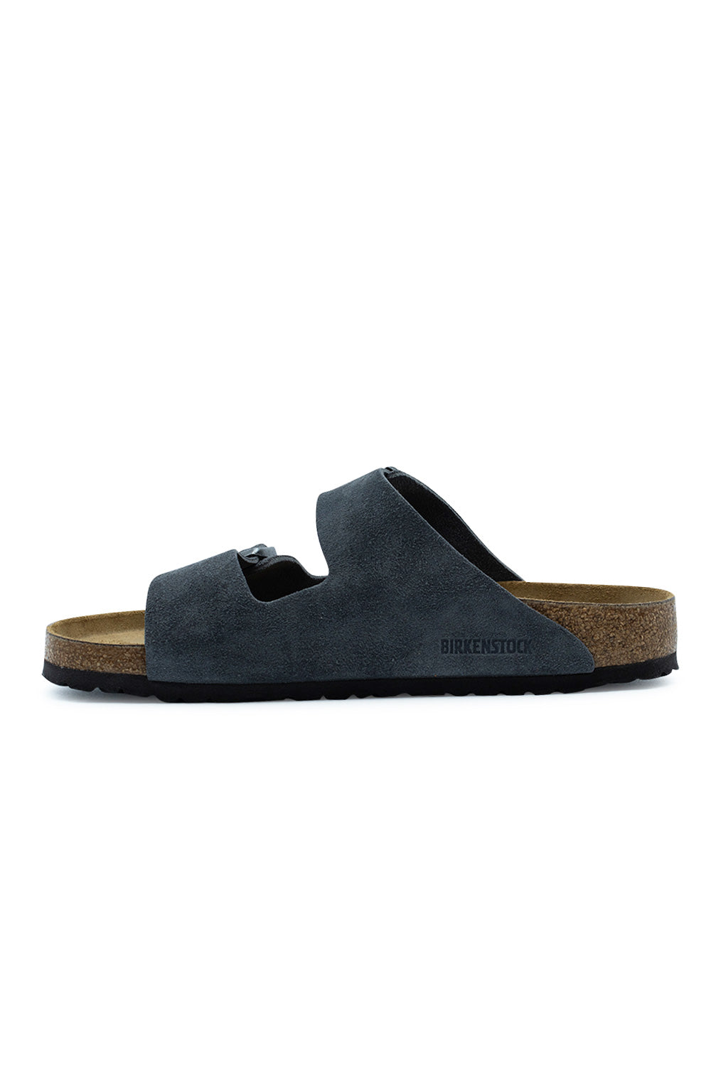 Medial side profile view of the Birkenstock Arizona BS Charcoal sandal, illustrating the clean inner suede strap panel with subtle embossed BIRKENSTOCK logo lettering along the lower edge.
