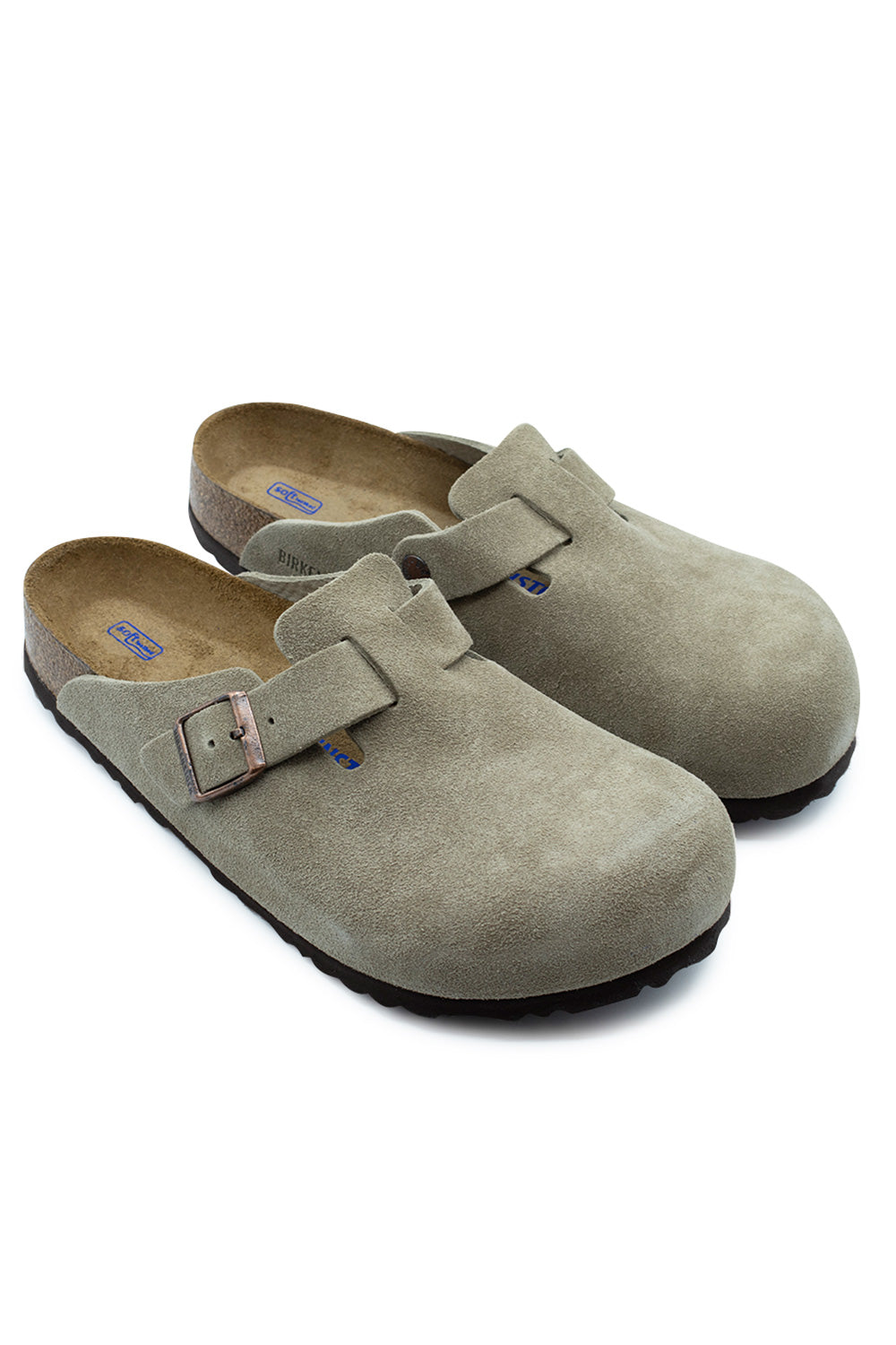 Three-quarter perspective studio shot of the Birkenstock Boston BS Clogs in Taupe suede, showcasing the classic mule shape, antique copper hardware, and ergonomic cork footbed structure.