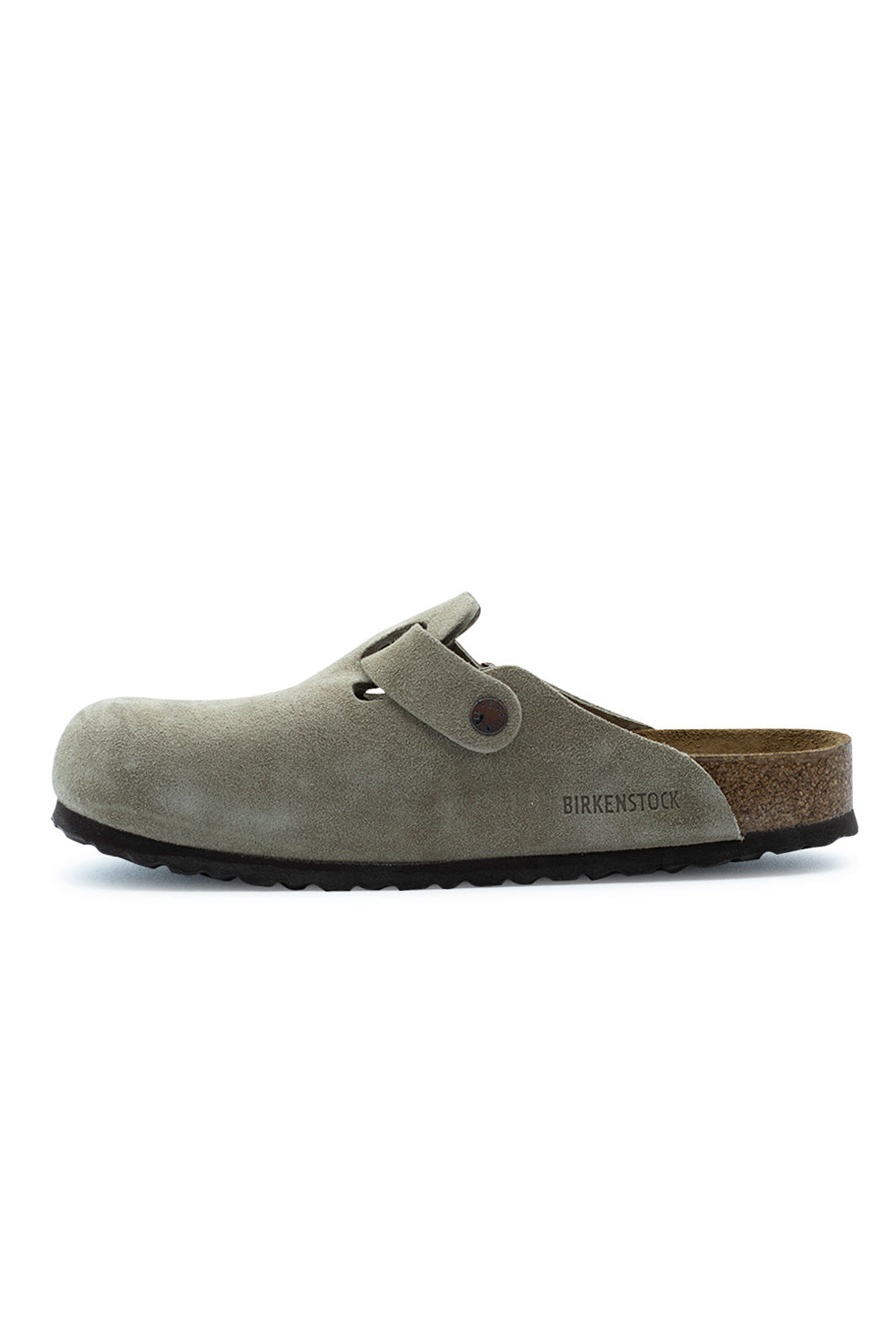 Medial side profile view of the Birkenstock Boston BS Taupe clog, illustrating the uninterrupted inner suede quarter panel with subtle embossed BIRKENSTOCK branding, metal rivet detail, and cork midsole.