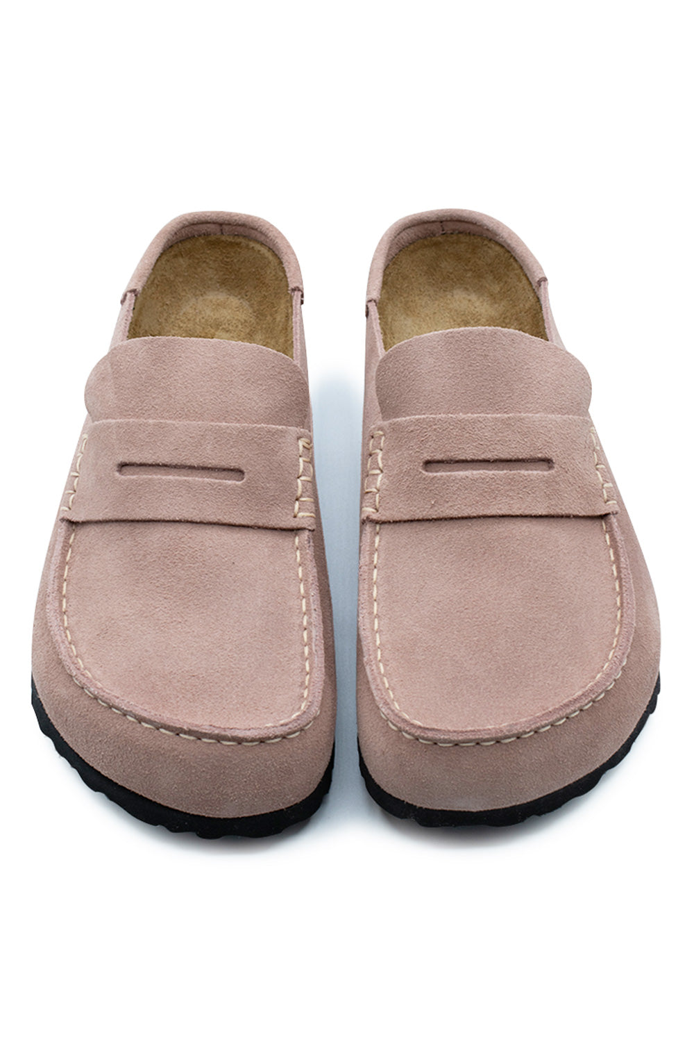 Top-down perspective of a pair of Birkenstock Naples Wrapped clogs in Pink Clay, highlighting the wide suede toe box with prominent moccasin apron stitching, instep penny loafer slots, and open slip-on heel construction.