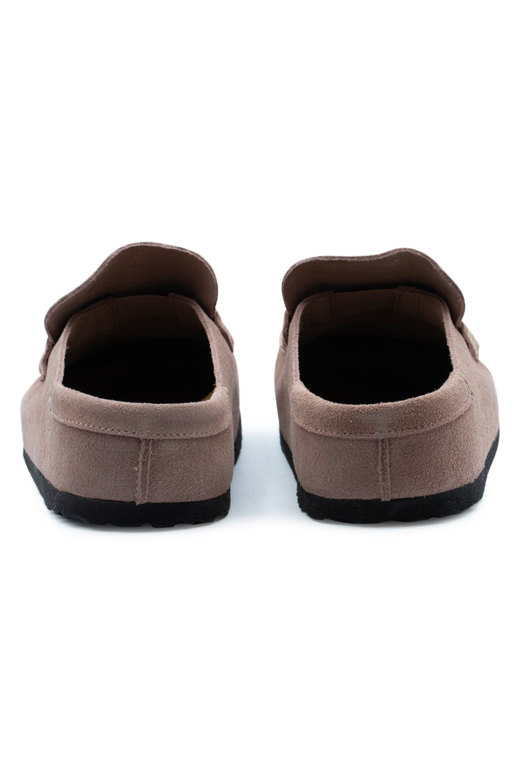 Rear view of the open heels of the Birkenstock Naples Wrapped Pink Clay suede shoes, showing the smooth suede heel collar stitching and thick black rubber outsole layer.