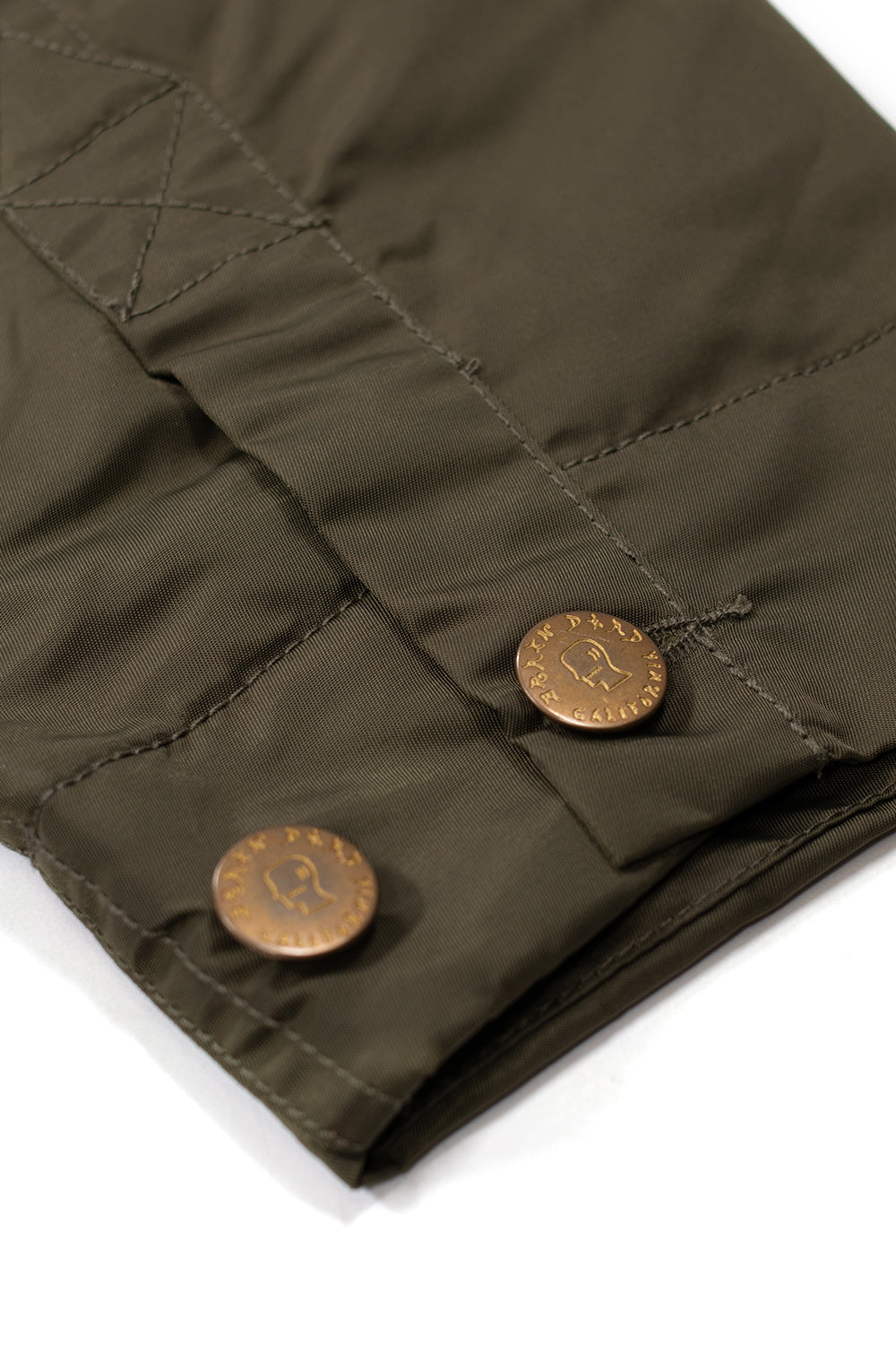 Brain Dead Cropped Chore Jacket Green, modern wide-fit nylon jacket with corduroy collar, water-repellent shell, and signature Brain Dead design from Los Angeles.