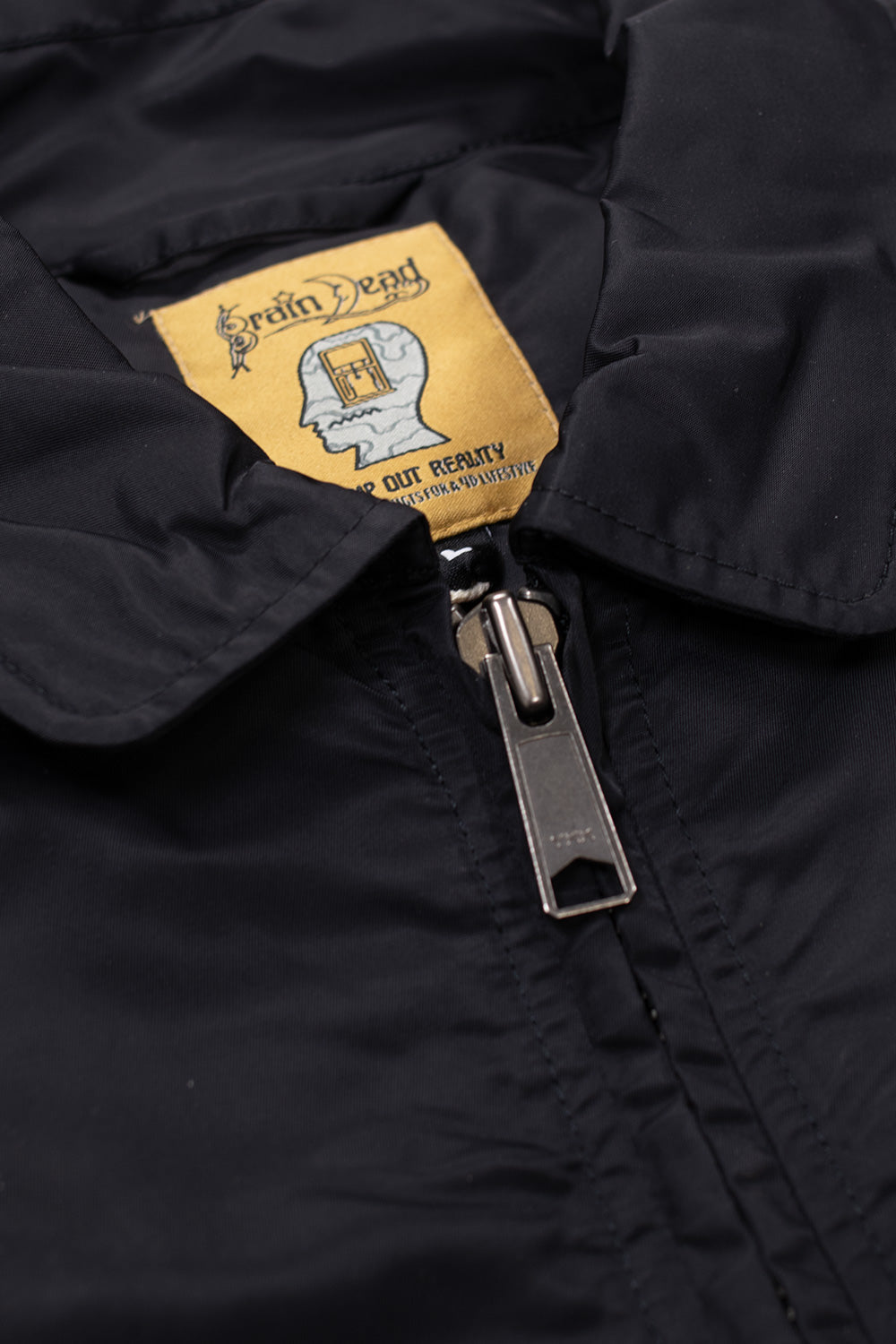 Brain Dead Embroidered 3D Flight Jacket Black, Los Angeles-designed nylon bomber featuring orange interior lining and durable construction.