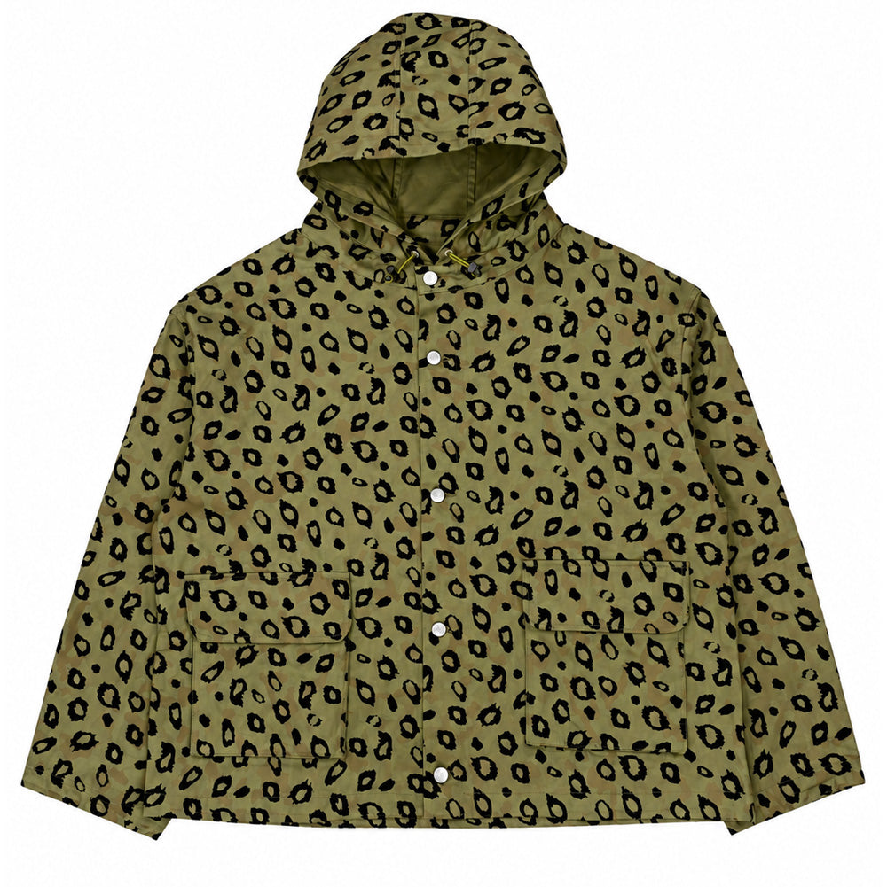 Front flat lay studio view of the Brain Dead Hooded Chore Coat in Flocked Leopard Camo, showcasing an oversized boxy workwear jacket crafted from heavyweight olive-drab cotton canvas overlaid with a tonal camouflage base and tactile black velvet flocked leopard rosettes, featuring a panelled drawstring hood, full snap-button front closure with custom silver hardware, and two large lower flap utility pockets.