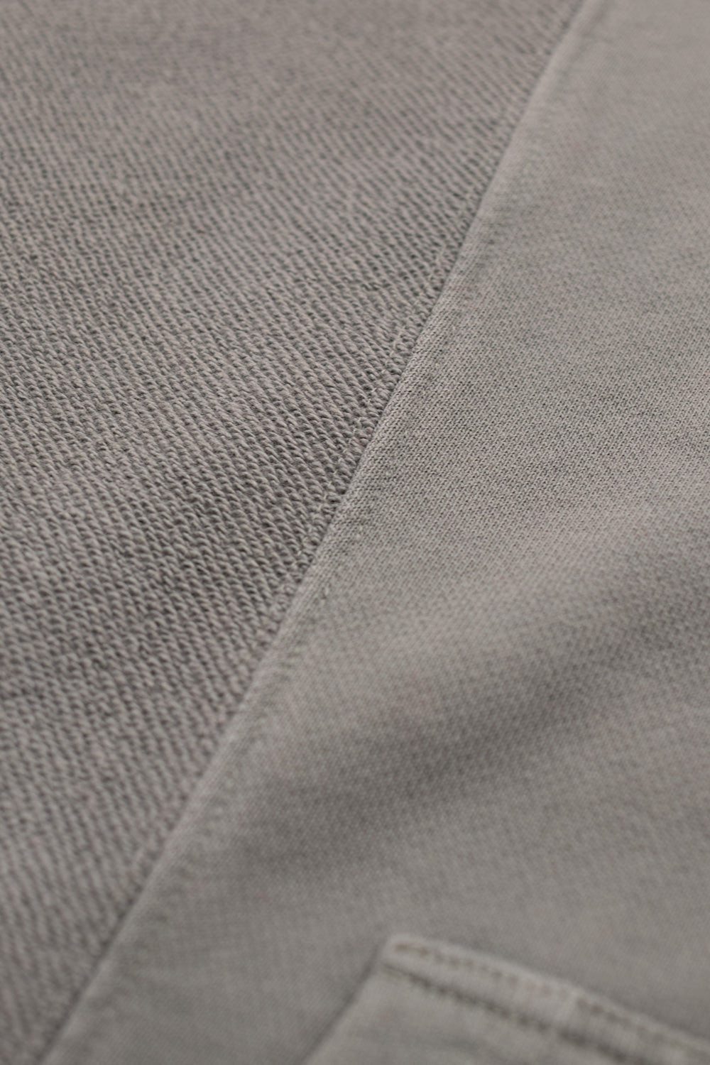 High-quality Brain Dead Mendoza Cropped Hoodie Cement, women’s and men’s cropped sweatshirt crafted from durable cotton with raw seam details.