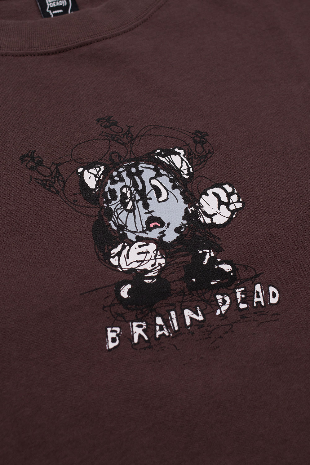 Close-up of Brain Dead Time Is Nigh T-Shirt Berry showing detailed chest artwork and Brain Dead logo print on heavyweight 100% cotton jersey graphic T-shirt designed by the Los Angeles streetwear collective