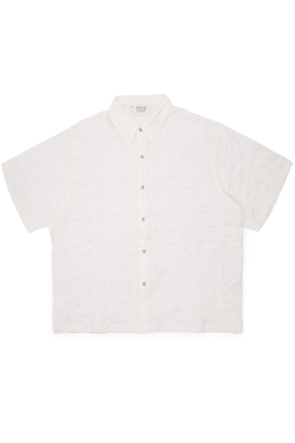 Brain Dead Twisted Piping Shirt Natural front view showing wide cropped fit cotton button down shirt with fully embroidered textured fabric, minimalist natural color and experimental Brain Dead Los Angeles streetwear design