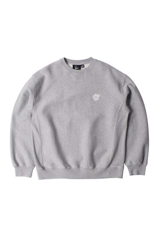Front flat lay view of the By Parra Balloon Logo Cross-Grain Crewneck sweatshirt in heather grey, crafted in Portugal from heavyweight 420-gram eco pre-washed cotton fleece, featuring a relaxed boxy cut, ribbed crew neckline with a subtle V-insert triangle stitch, ribbed side rib gussets, elastic ribbed hem and cuffs, and small white embroidered circular balloon logo lettering on the left chest.