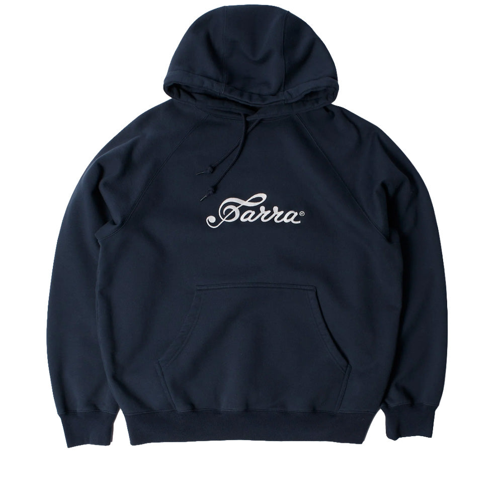 Front flat lay studio view of the By Parra Musical Chairs Hooded Sweatshirt in dark navy blue, showcasing a relaxed heavyweight cotton fleece pullover silhouette, comfortable raglan sleeves, matching round hood drawstrings with knotted ends, large kangaroo pouch pocket, wide ribbed cuffs and hem, and a centered white embroidered cursive Parra script logo across the chest.