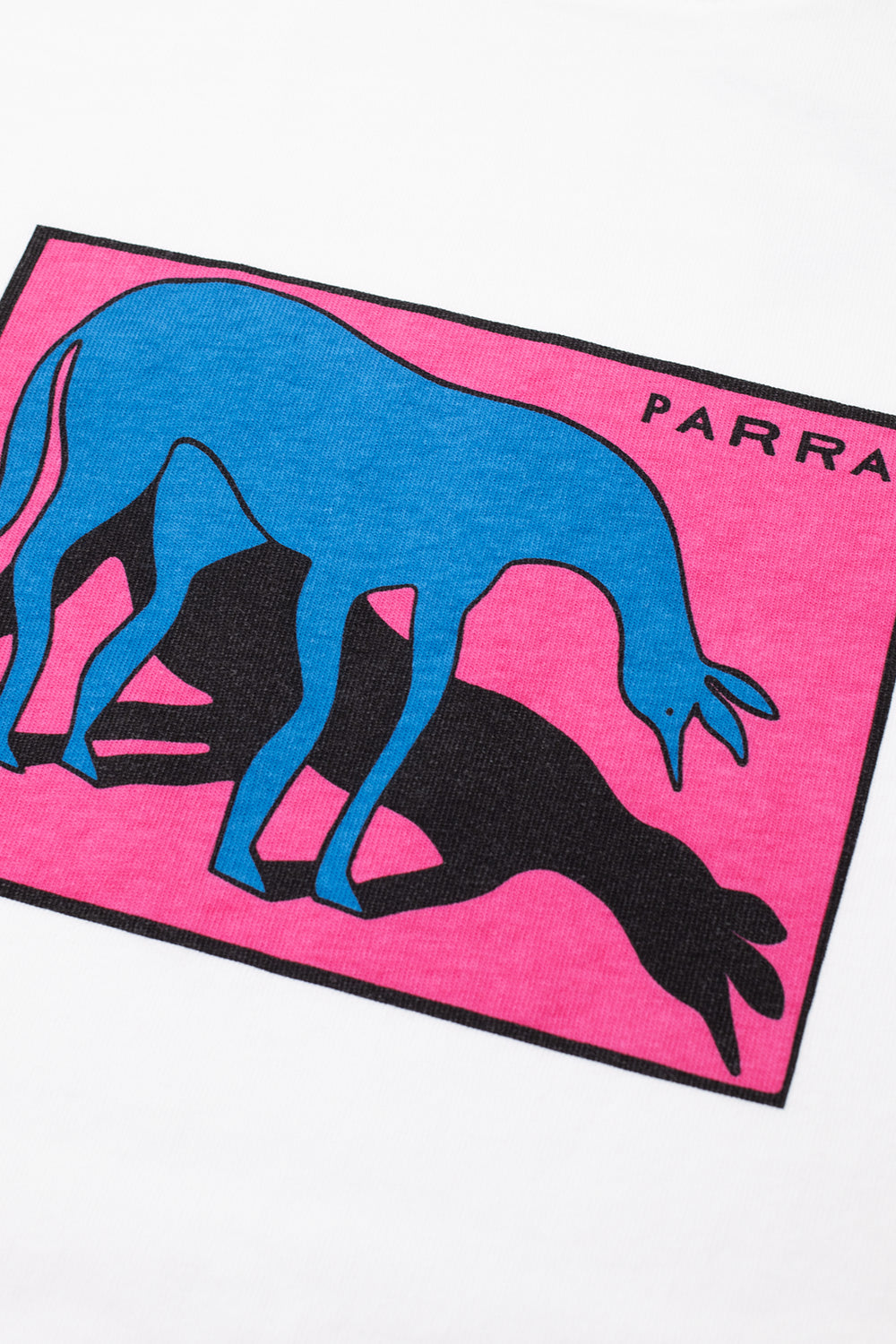 Macro close-up shot of the graphic chest print on the white By Parra Sad Horse T-Shirt, displaying the soft-touch water-based ink screen print with a solid black border frame, bright magenta pink backdrop, a bowing cyan blue horse with elongated ears, cast shadow, and crisp black Parra block lettering in the upper corner.