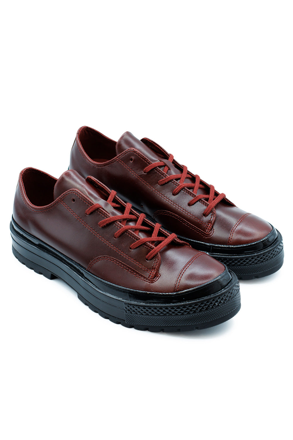 Side view of Converse Chuck 70 National OX Rottin Apple Black, formal-inspired sneaker with vintage All Star license plate and bold design.