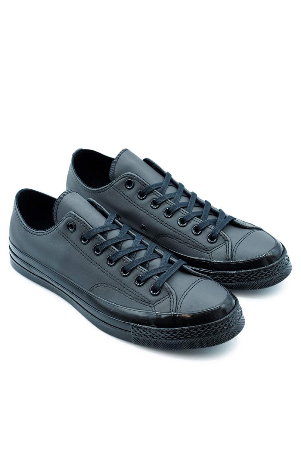 Side view of Converse Chuck 70 OX Black Dark Matter Black featuring black midsole, detailed stitching, and elevated rubber sidewall.