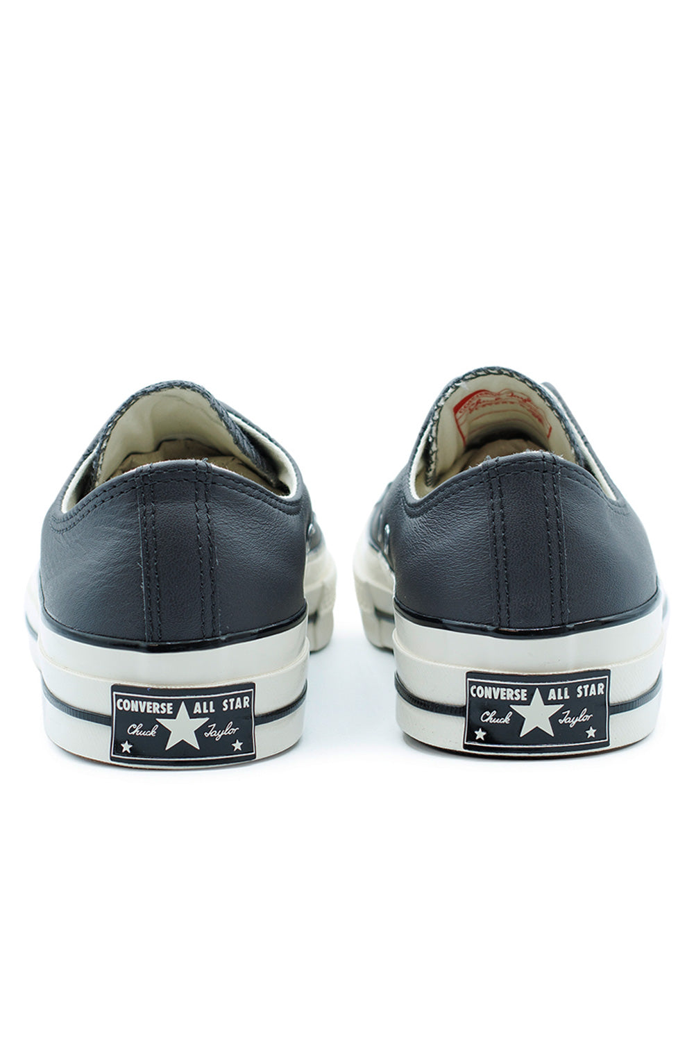 Converse Chuck 70 OX Dark Matter Egret leather sneaker, low-top design with OrthoLite insole, higher sidewall, and retro basketball roots.