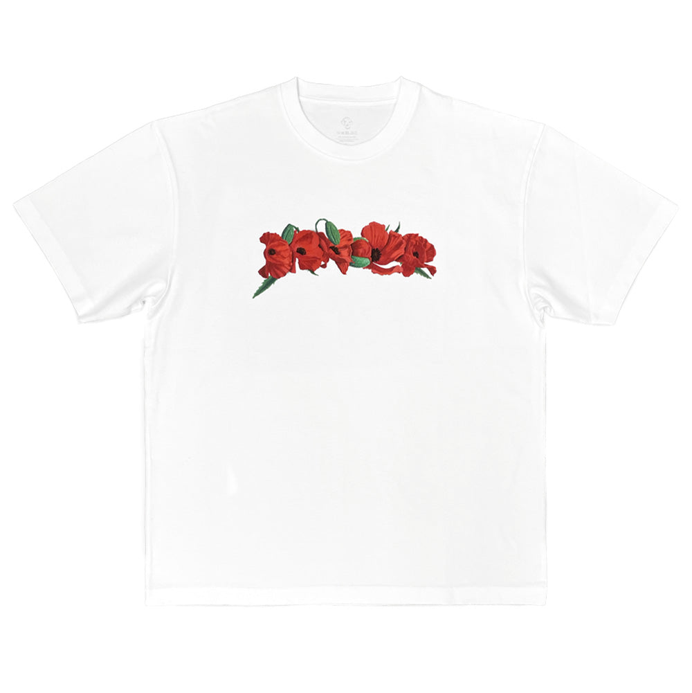 Front flat lay view of the Dancer Poppy Flowers T-Shirt in crisp white, showcasing a relaxed boxy-fit short-sleeve skate tee made from organic cotton jersey, featuring a ribbed crewneck collar, straight hemline, and a horizontal screen-printed chest graphic depicting an arched garland arrangement of blooming red poppy flowers with green stems and buds.