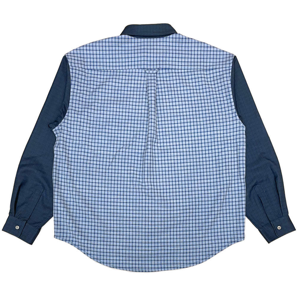 Back flat lay view of the Dancer Split Checked Shirt in Navy, highlighting the split construction with a full back panel crafted from light blue and navy check fabric, contrast dark navy sleeves and collar, buttoned cuffs, and a center box pleat beneath the back yoke seam.