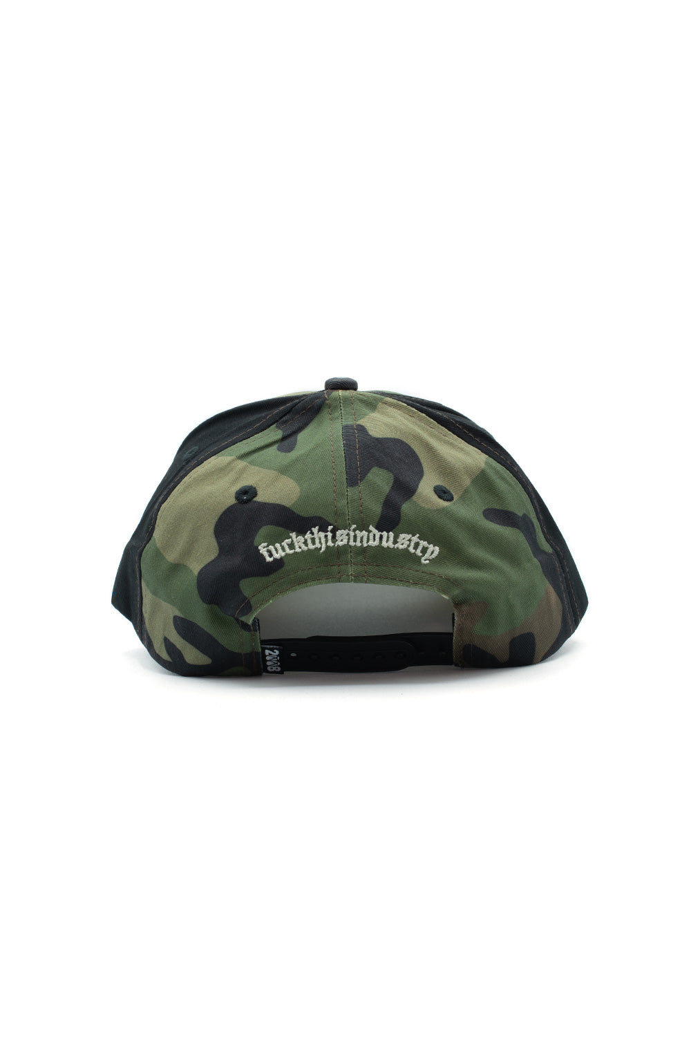 Rear view of the Fuck This Industry Mystery Hat in Camo, showing the curved woodland camouflage back panels, black side panels, arched white Old English embroidery reading "fuckthisindustry", and an adjustable black plastic snapback closure strip accented with a small woven "2008" flag label