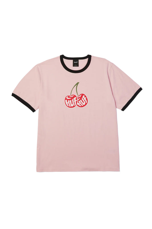 Front flat lay view of the HUF Cherries Ringer T-Shirt in dusty pink, crafted from 180-gram 100% cotton jersey, showcasing black contrast ribbing at the crewneck collar and short sleeve cuffs, alongside a centered chest screen print of two bright red cherries with green stems containing white stylized "HUF" lettering.