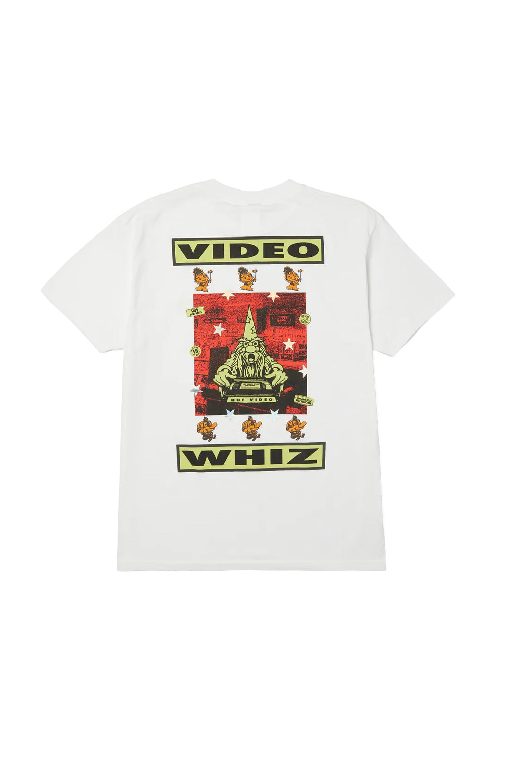 Back flat lay view of the white HUF Video Genie T-Shirt, crafted from 250g 100% cotton, featuring a large multicolor graphic framed by bold black "VIDEO" and "WHIZ" typography, displaying a central wizard holding a VHS tape on a red halftone background, surrounded by yellow cartoon genies and holographic silver stars