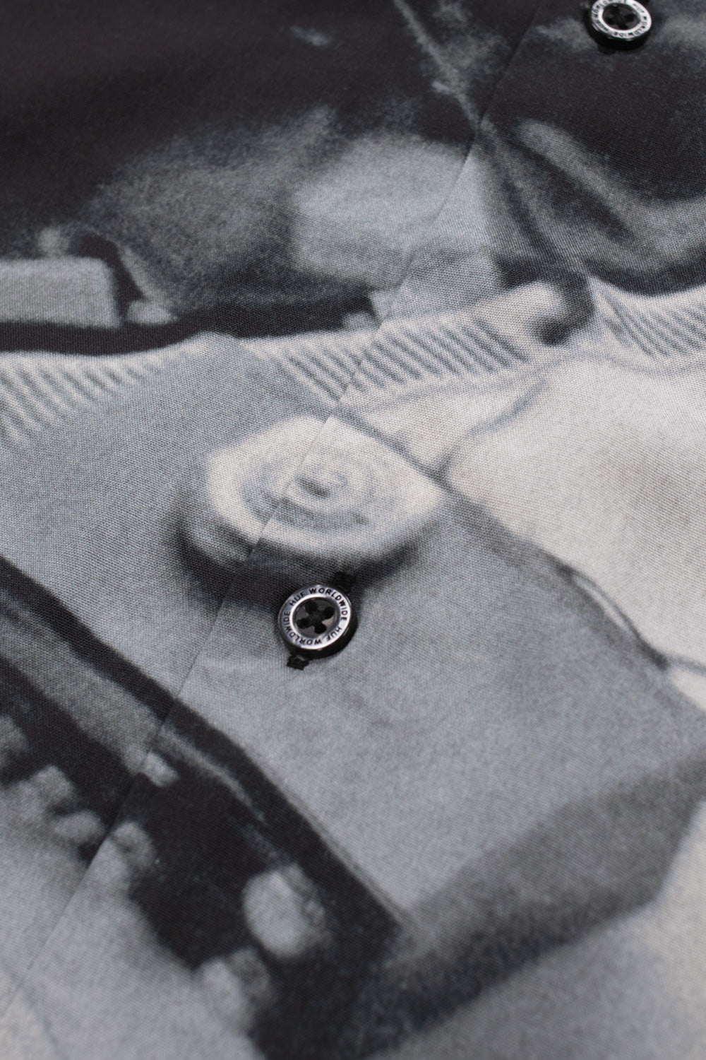 Close-up of the HUF x Dennis McGrath Burnside Shirt featuring documentary-style black and white photography print, artist collaboration artwork and premium rayon fabric