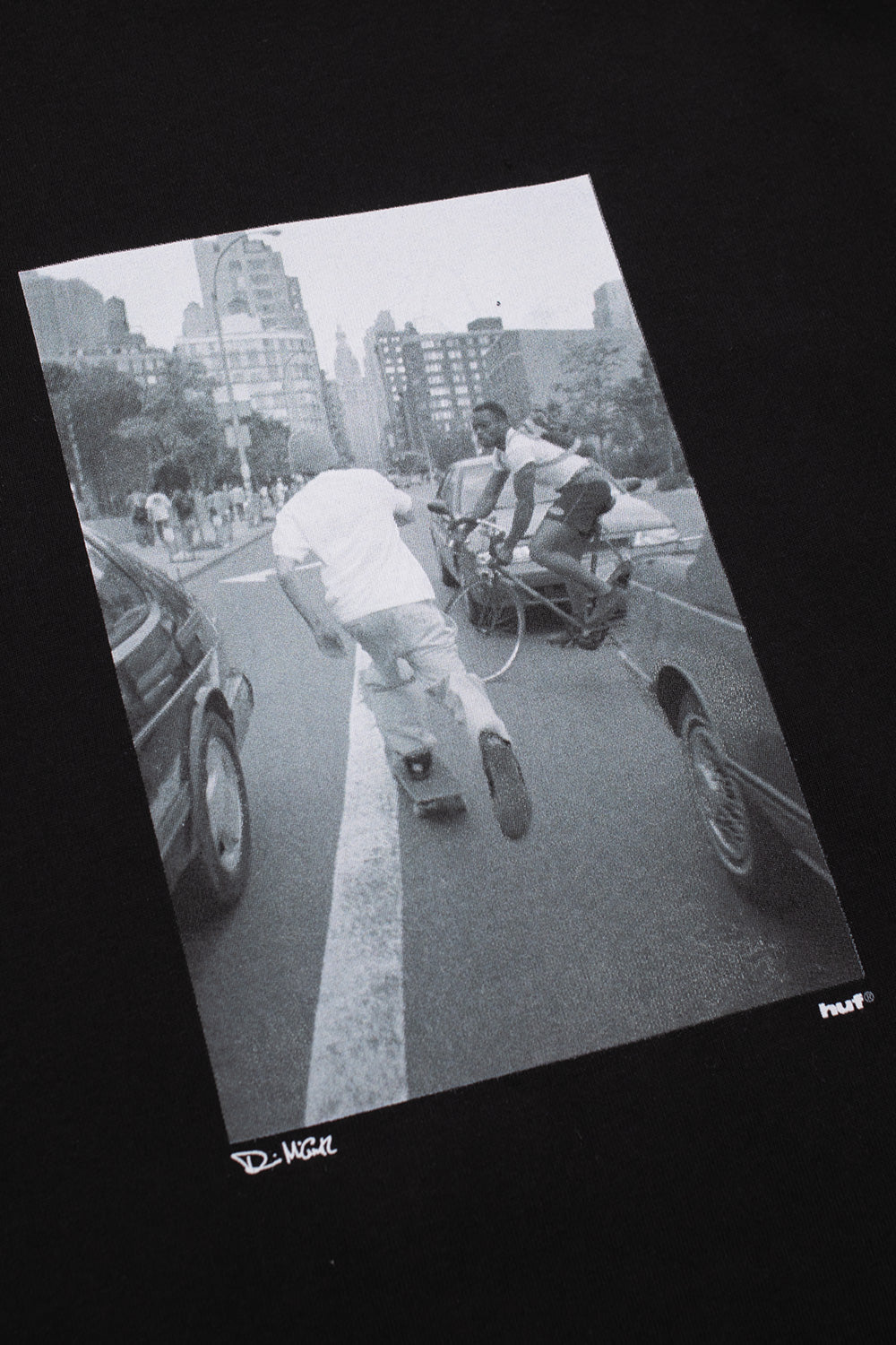 Detailed view of the Dennis McGrath archival skate photo graphic on the HUF Fight The Traffic Tee, celebrating authentic 1990s street skating culture