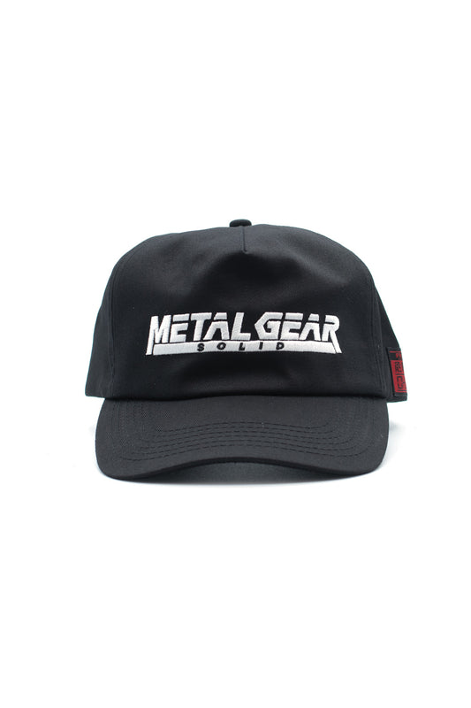 Black HUF x Metal Gear Solid snapback cap with embroidered Metal Gear Solid logo on front, official gaming collaboration streetwear hat made from 100 percent cotton