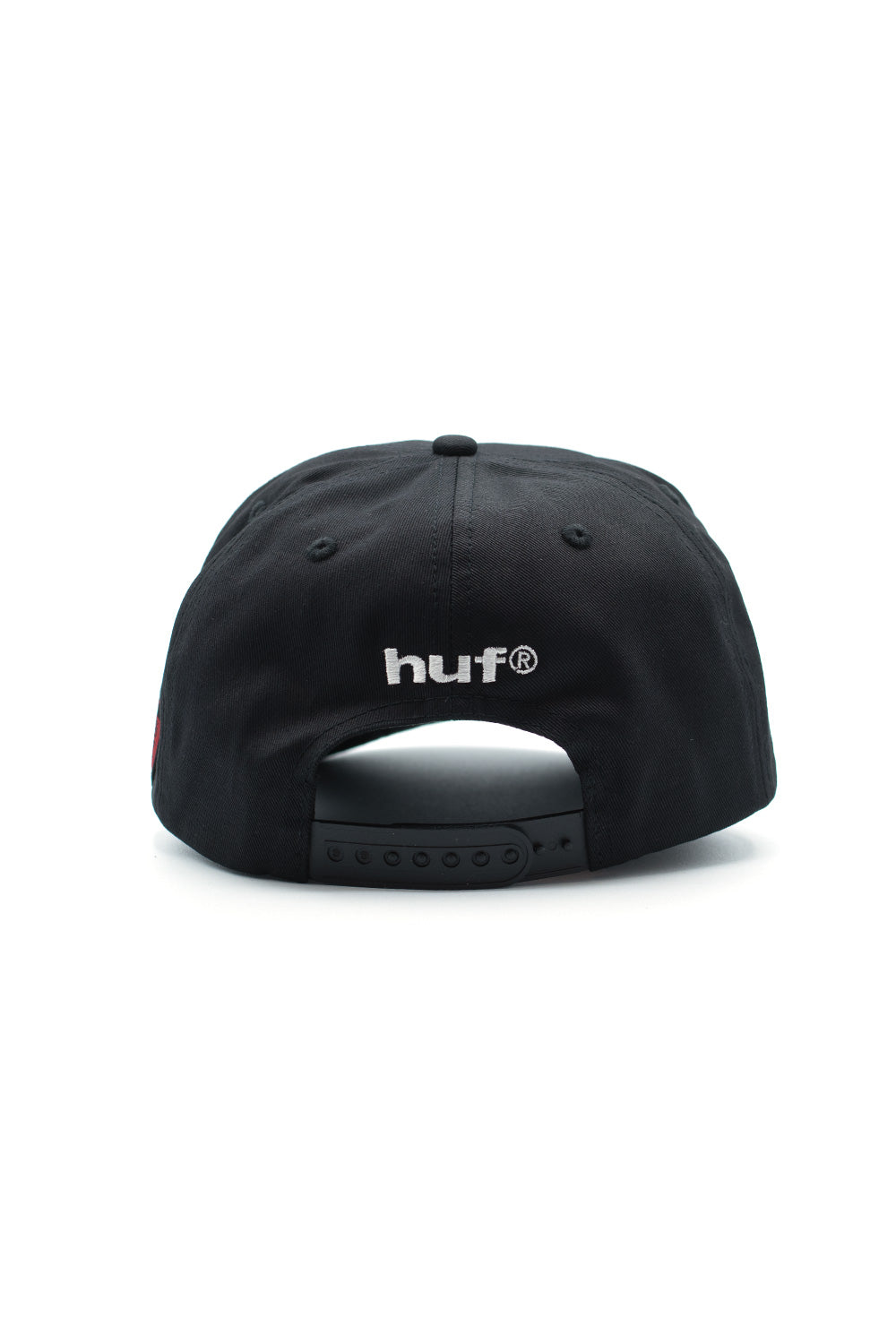 Rear view of HUF x Metal Gear Solid snapback in black featuring embroidered HUF logo, adjustable plastic closure, and premium cotton construction