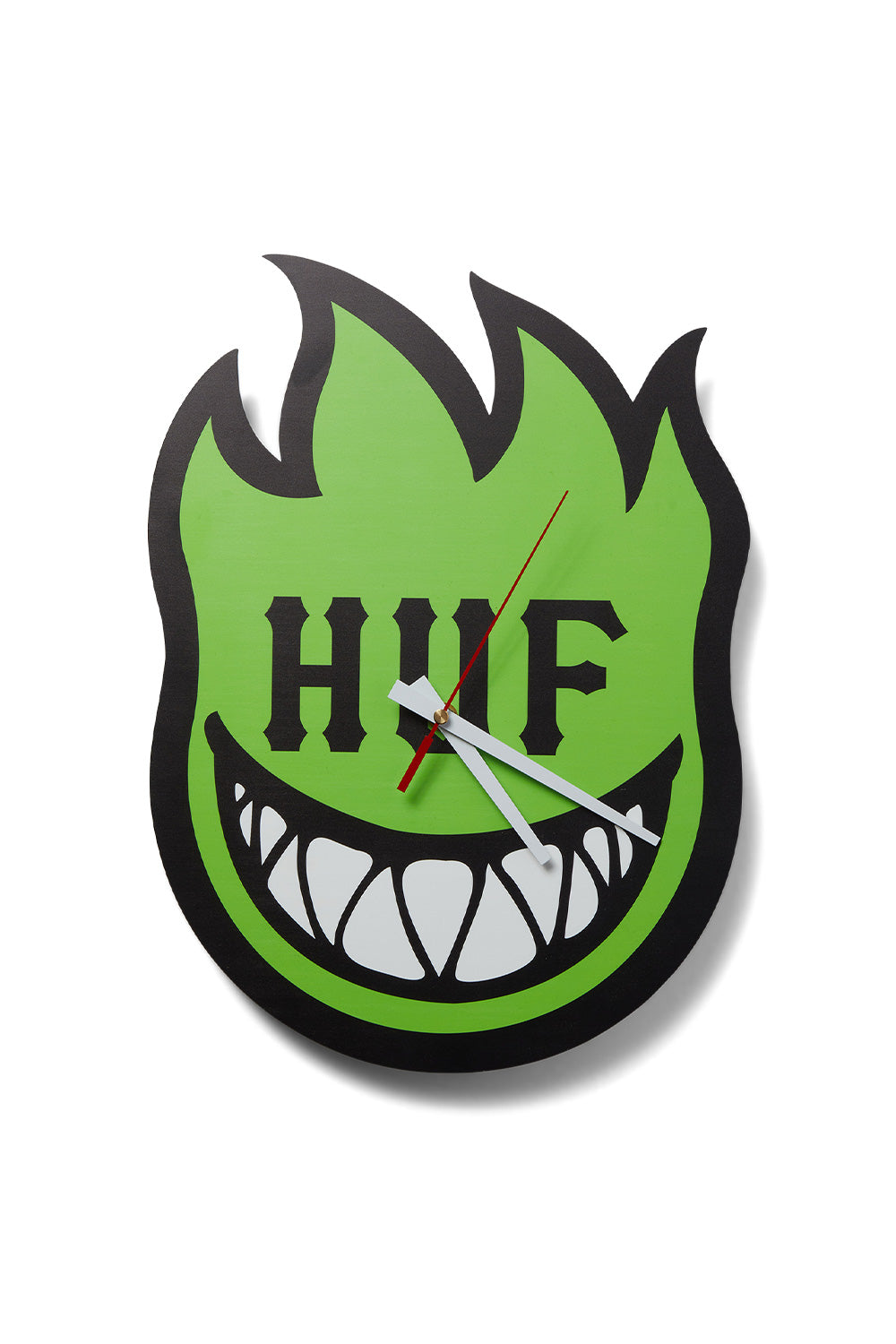 Front view of the green HUF X Spitfire Bighead acrylic wall clock, cut out in the shape of the iconic Spitfire flame head with white clock hands, a red second hand, jagged teeth graphic, and bold black HUF typography centered across the face.