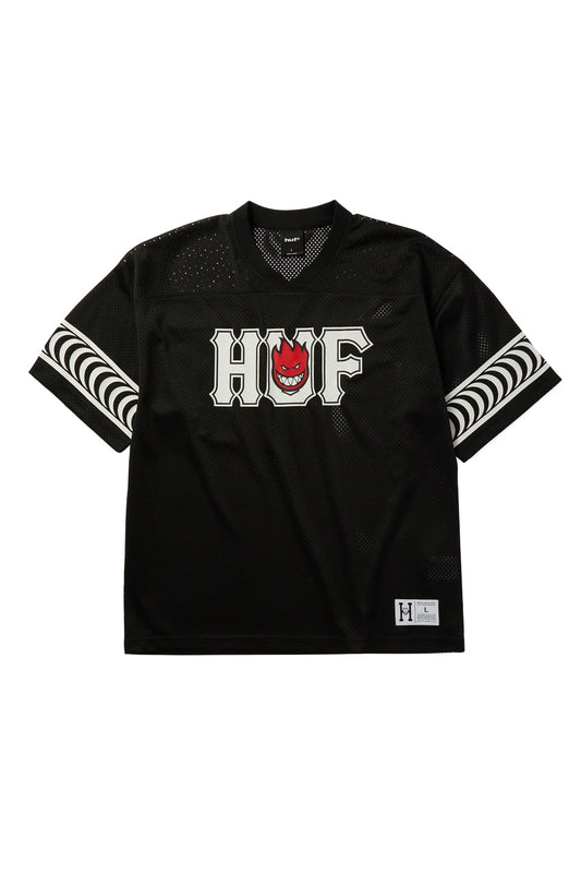 Front view of the black HUF X Spitfire End Zone Jersey, constructed from breathable 215gsm polyester mesh in a boxy athletic football cut, featuring a ribbed V-neck collar, drop shoulders, white screen-printed collegiate HUF lettering with an integrated red Spitfire Bighead flame logo on the chest, white Spitfire Classic Swirl stripes printed around the sleeves, and a collaborative jock tag sewn near the bottom hem.