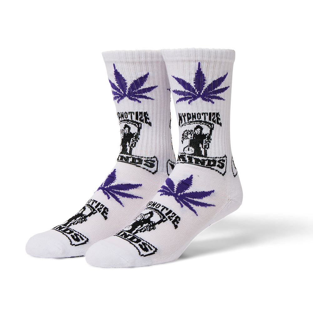 Three-quarter studio view of a pair of white Huf X Three 6 Mafia Hypnotize Minds Plantlife crew socks[cite: 94], featuring ribbed upper cuffs[cite: 94], alternating knit jacquard graphics with purple Plantlife cannabis weed leaves on the leg and forefoot[cite: 94], and black-and-white Hypnotize Minds record label grim reaper logos with hourglass emblems across the mid-shin and top of the foot[cite: 94].