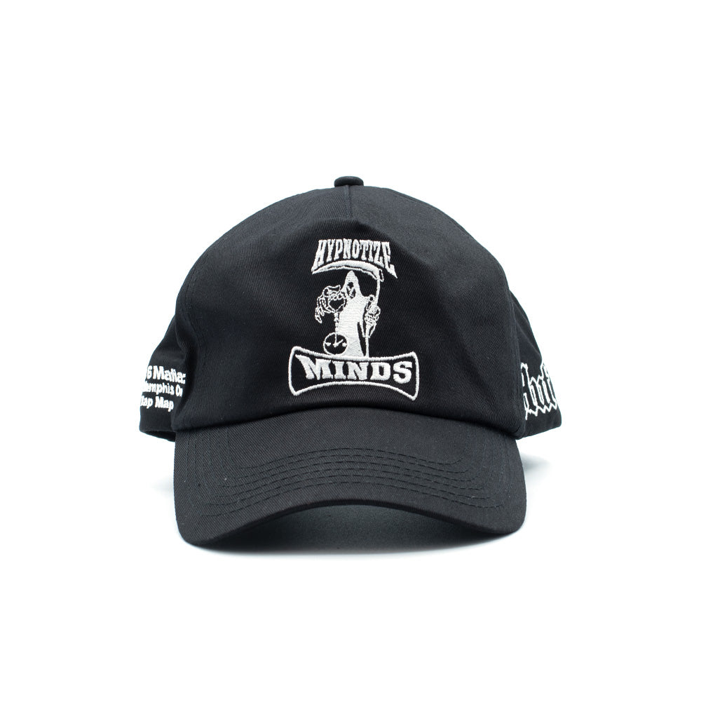 Front studio portrait of the black HUF x Three 6 Mafia Snapback cap, showcasing a structured cotton twill crown, a curved black visor with tonal stitching, and a prominent center-front white satin-stitch embroidery depicting the iconic Hypnotize Minds Grim Reaper holding a scythe above a banner.