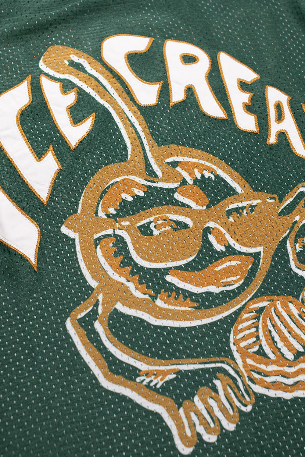Ice Cream football shirt in vibrant green with a playful cherry applique for streetwear