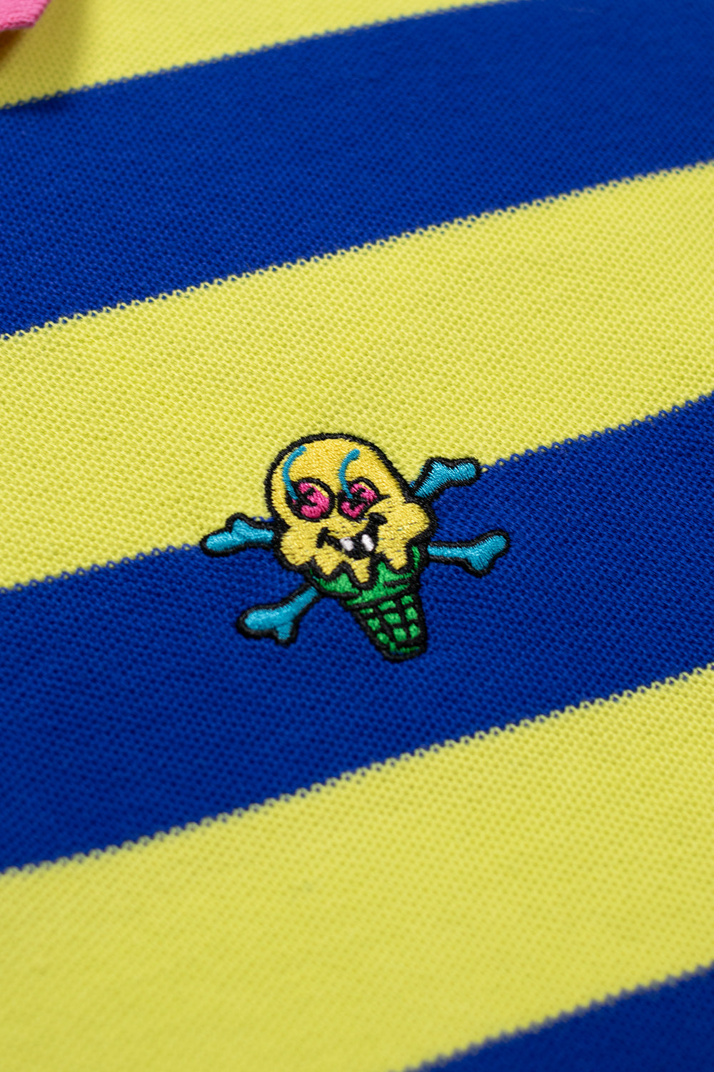 Ice Cream striped polo shirt with a green and blue color scheme and playful cones & bones logo