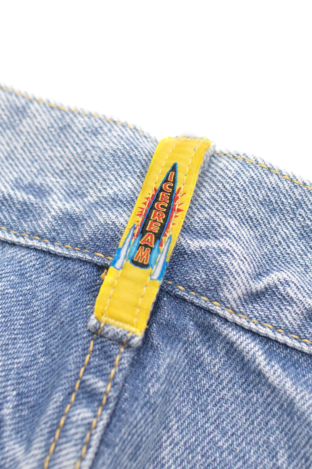 Ice Cream streetwear denim shorts in light wash blue with dynamic red dog print