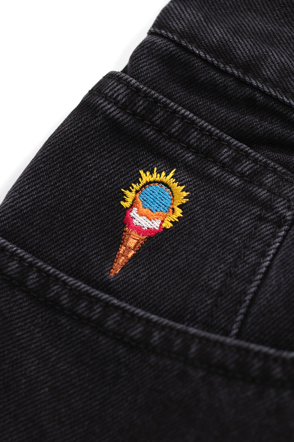 Streetwear-inspired Ice Cream Running Dog double scoop denim pants in black and green