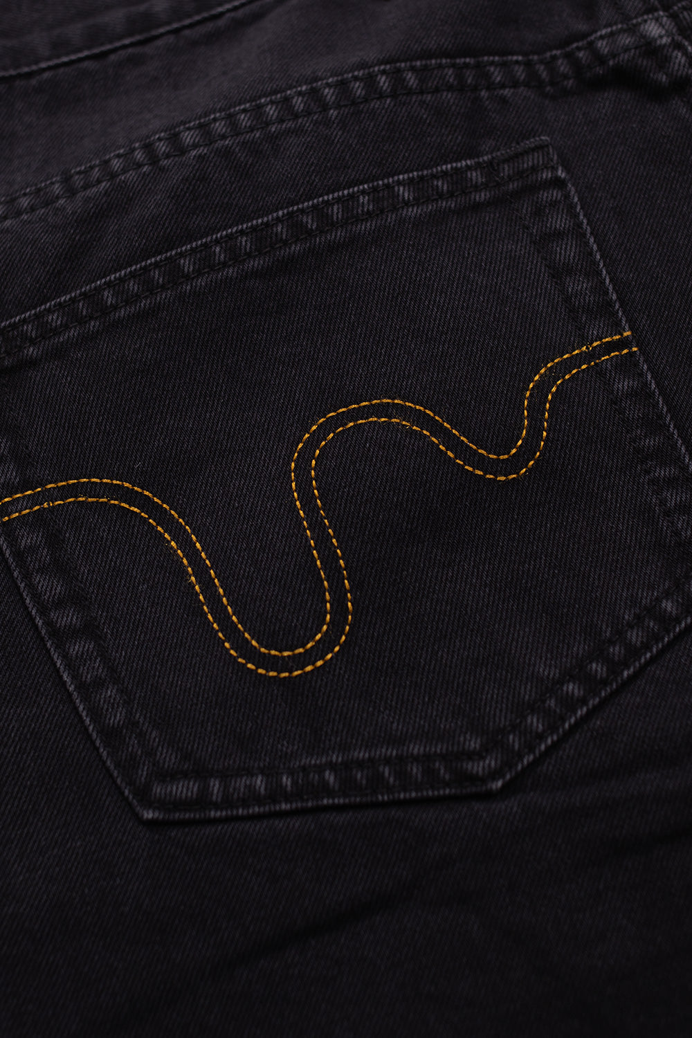 Stylish black denim pants by Ice Cream with bold green Running Dog print for casual wear
