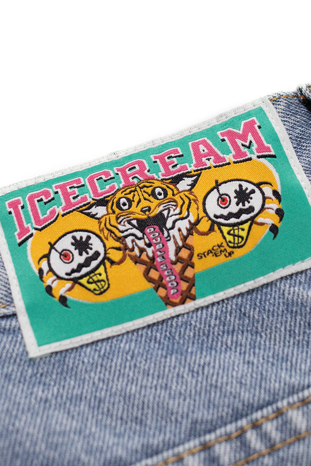 Trendy light wash denim pants by Ice Cream with red double scoop and dog logo print