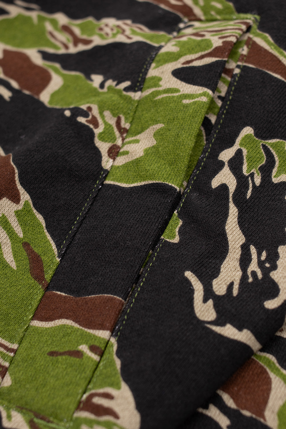 Stitching and pocket detail of IceCream Tiger Stripe Camo Full Zip-Through Hood, highlighting quality construction and mid-weight cotton fabric.