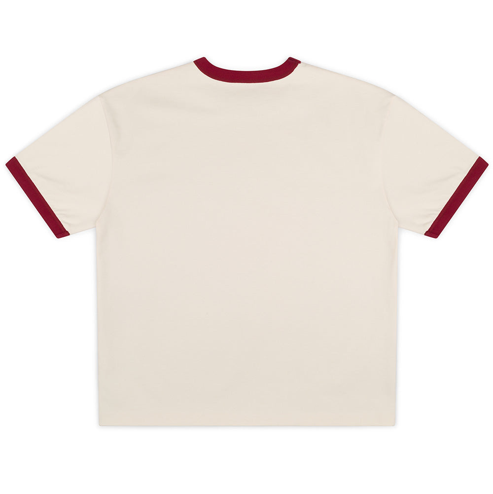 Back flat lay studio perspective of the cream Bone side of the Metalwood Studio Dual Face T-Shirt, highlighting the clean dropped shoulders, seamless unprinted back panel, straight hemline, and contrasting dark red ribbed collar and sleeve bindings.
