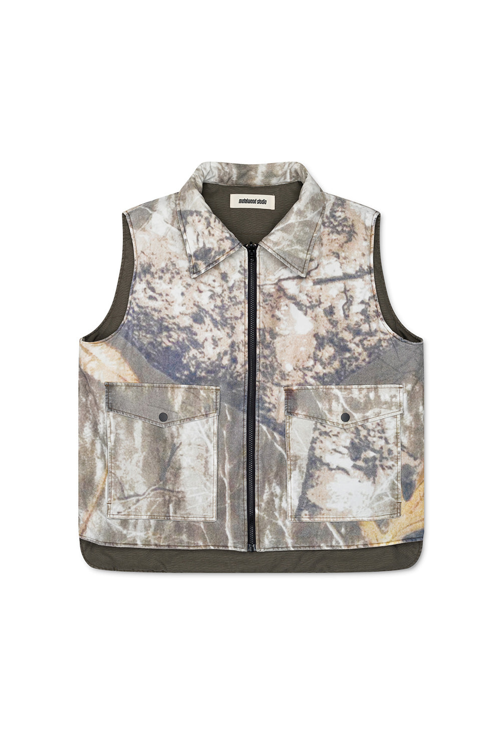 Metalwood Studio poly-filled reversible vest in fatigue green, offering versatility and warmth for all seasons.