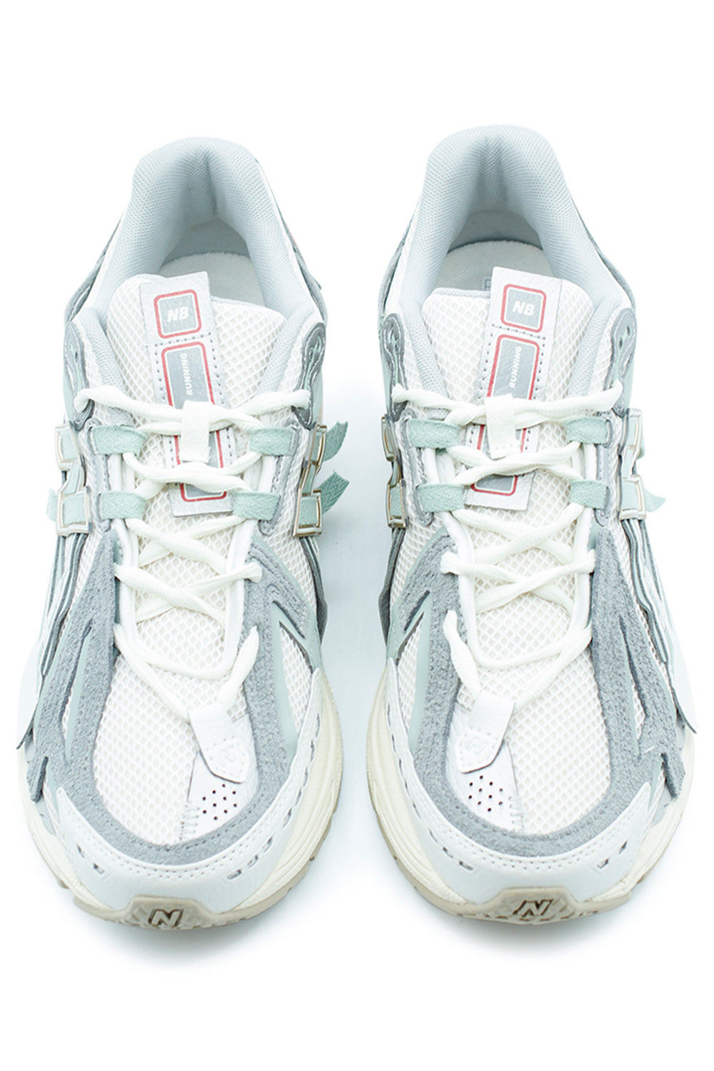 Front view of New Balance 1906A running-inspired sneaker in Sea Salt and grey tones featuring open mesh toe box, lace system, technical overlays and lightweight ACTEVA LITE midsole