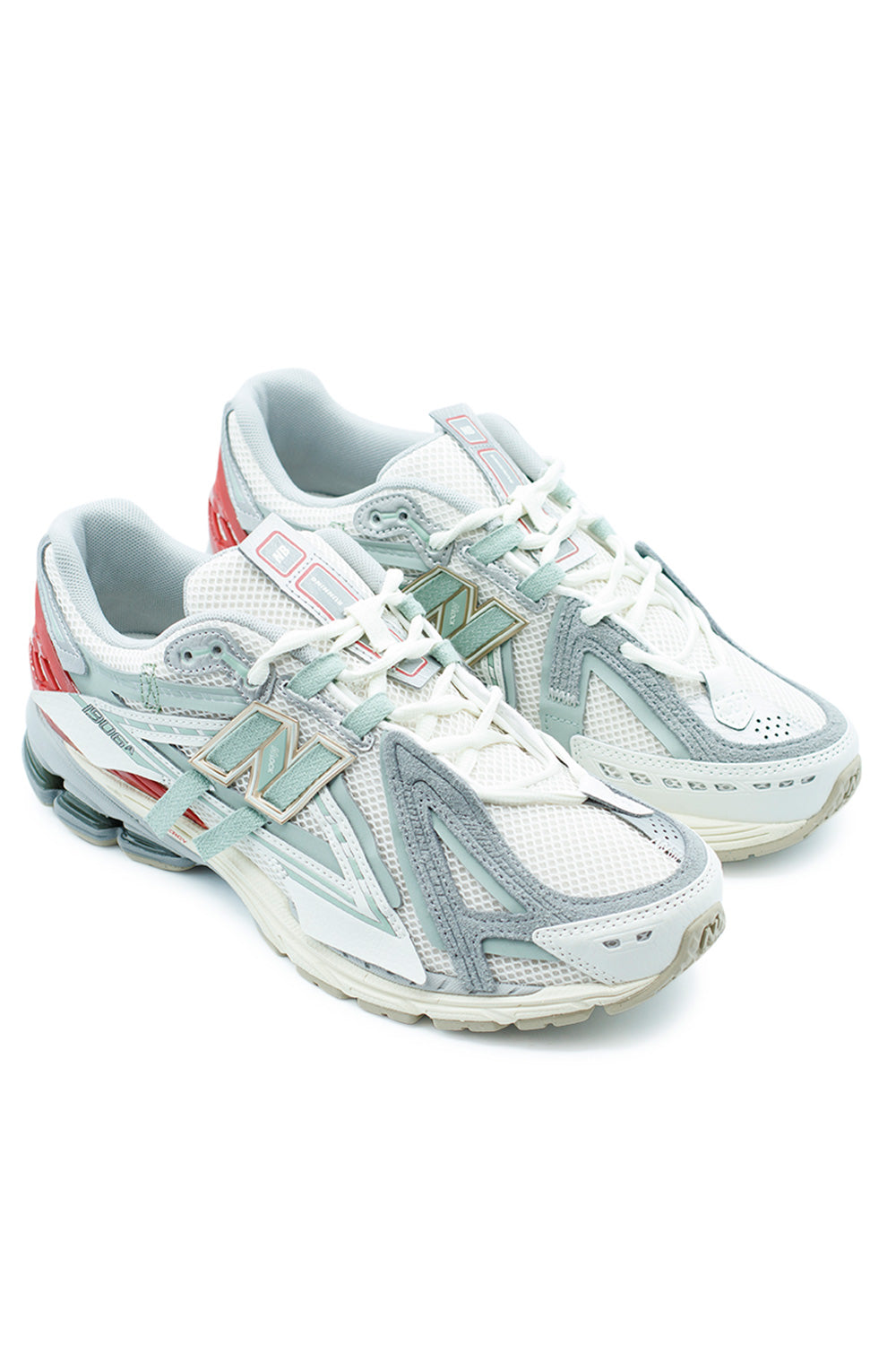 Angled pair shot of New Balance 1906A Sea Salt Lone Star Grey sneakers with futuristic Y2K running design, layered mesh construction and premium performance sole unit