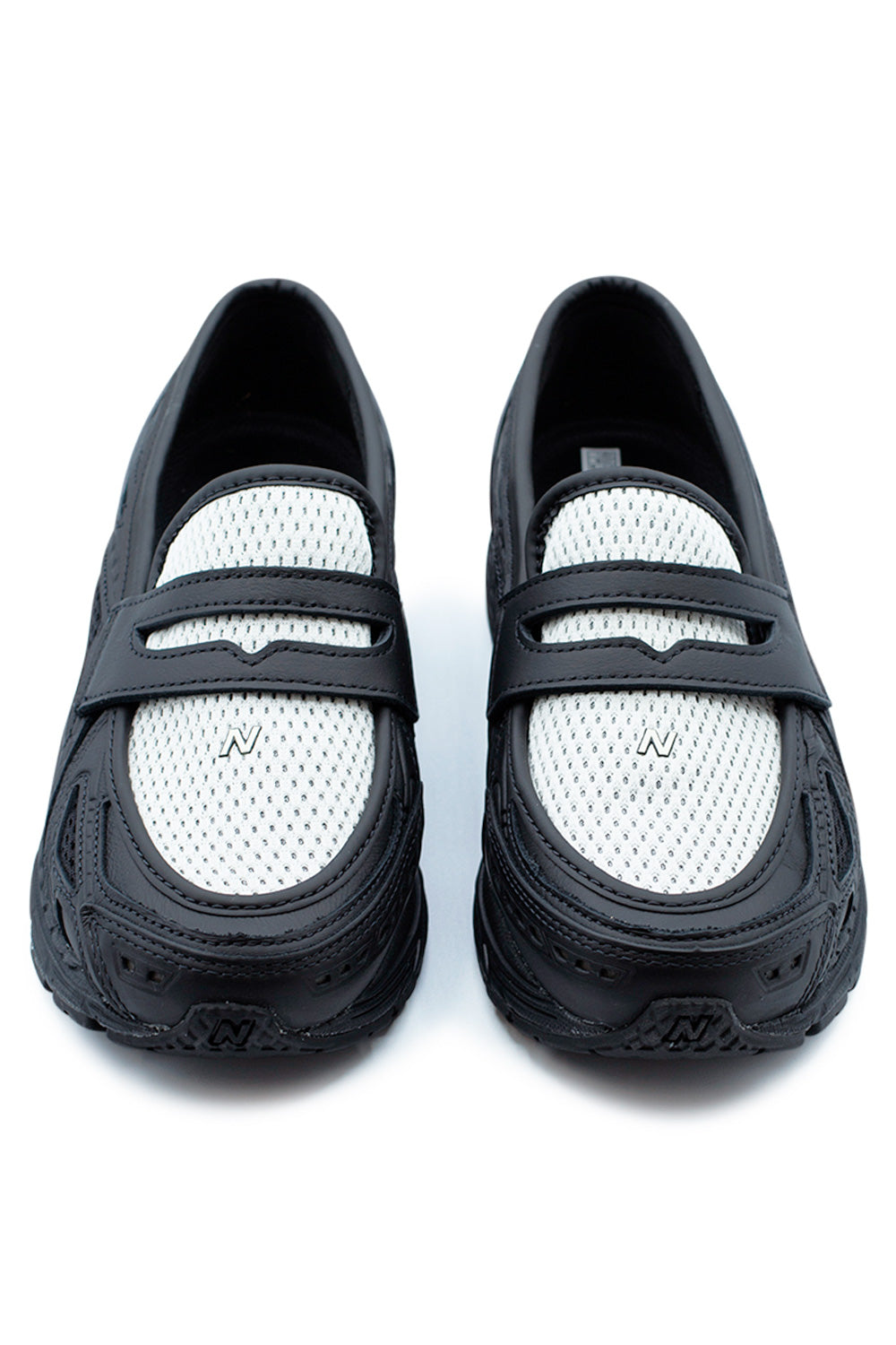 Top view of the New Balance 1906L Black / Angora showing breathable mesh vamp, leather loafer strap and technical sneaker construction inspired by the iconic 1906 running silhouette.