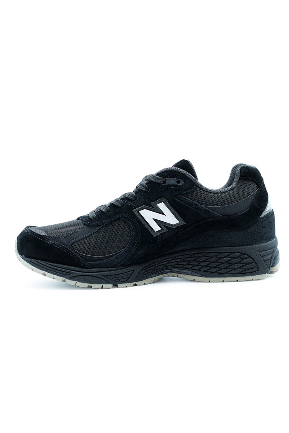New Balance 2002R Shoe – Black Timberwolf White running-inspired sneaker with suede mesh upper, cushioned ABZORB midsole, and durable outsole.