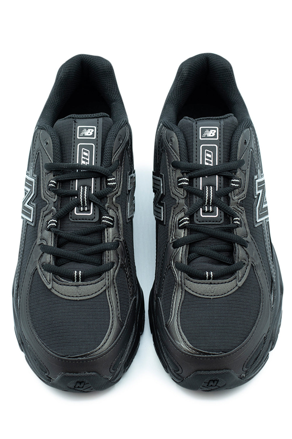 New Balance 740 Black Silver Metallic unisex running shoe, heritage-inspired sneaker with reflective accents and durable rubber outsole.