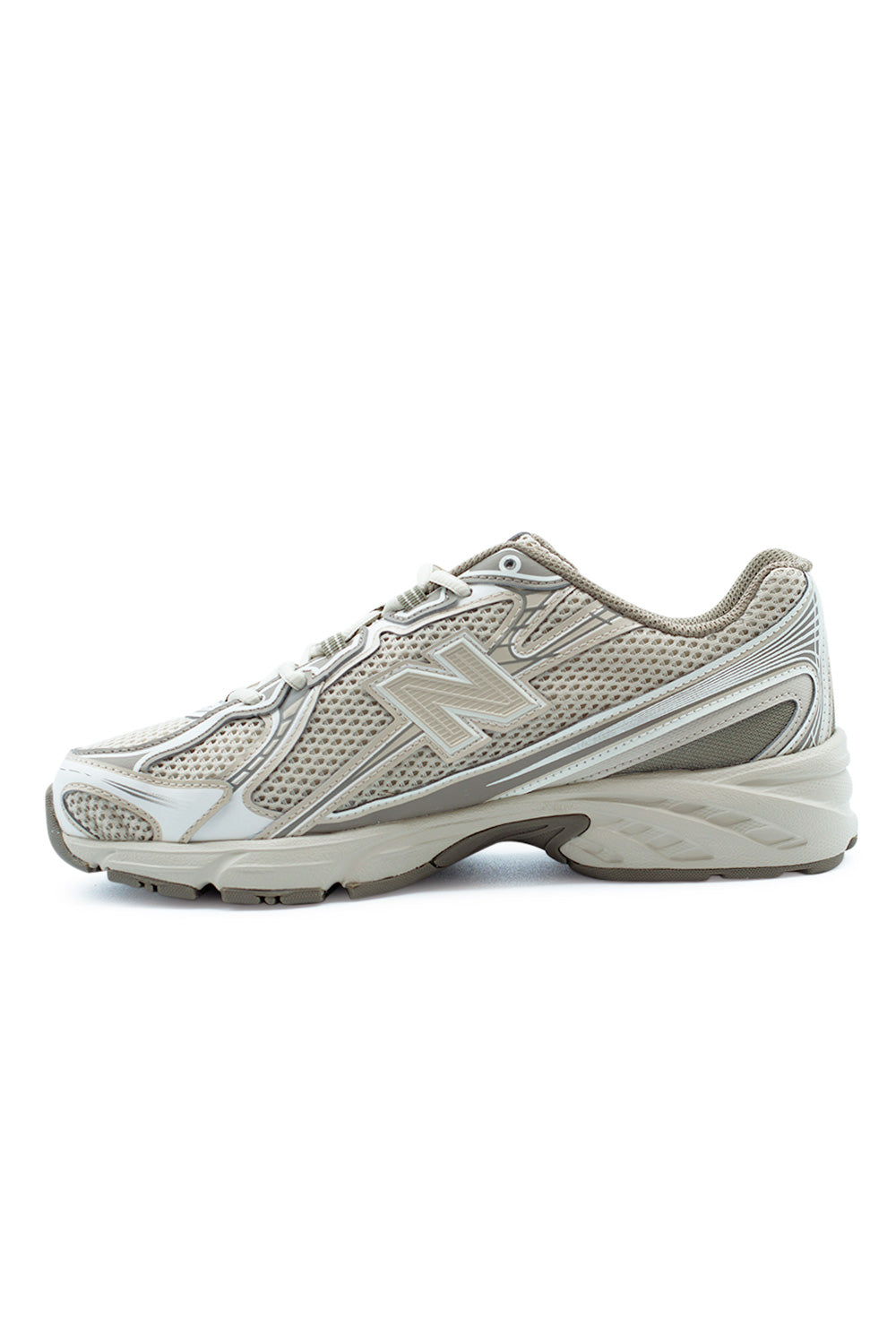 Lateral profile of New Balance 740 retro running sneaker in Dockside Timberwolf colorway, showcasing streamlined silhouette, breathable mesh underlays and durable rubber outsole for daily use.