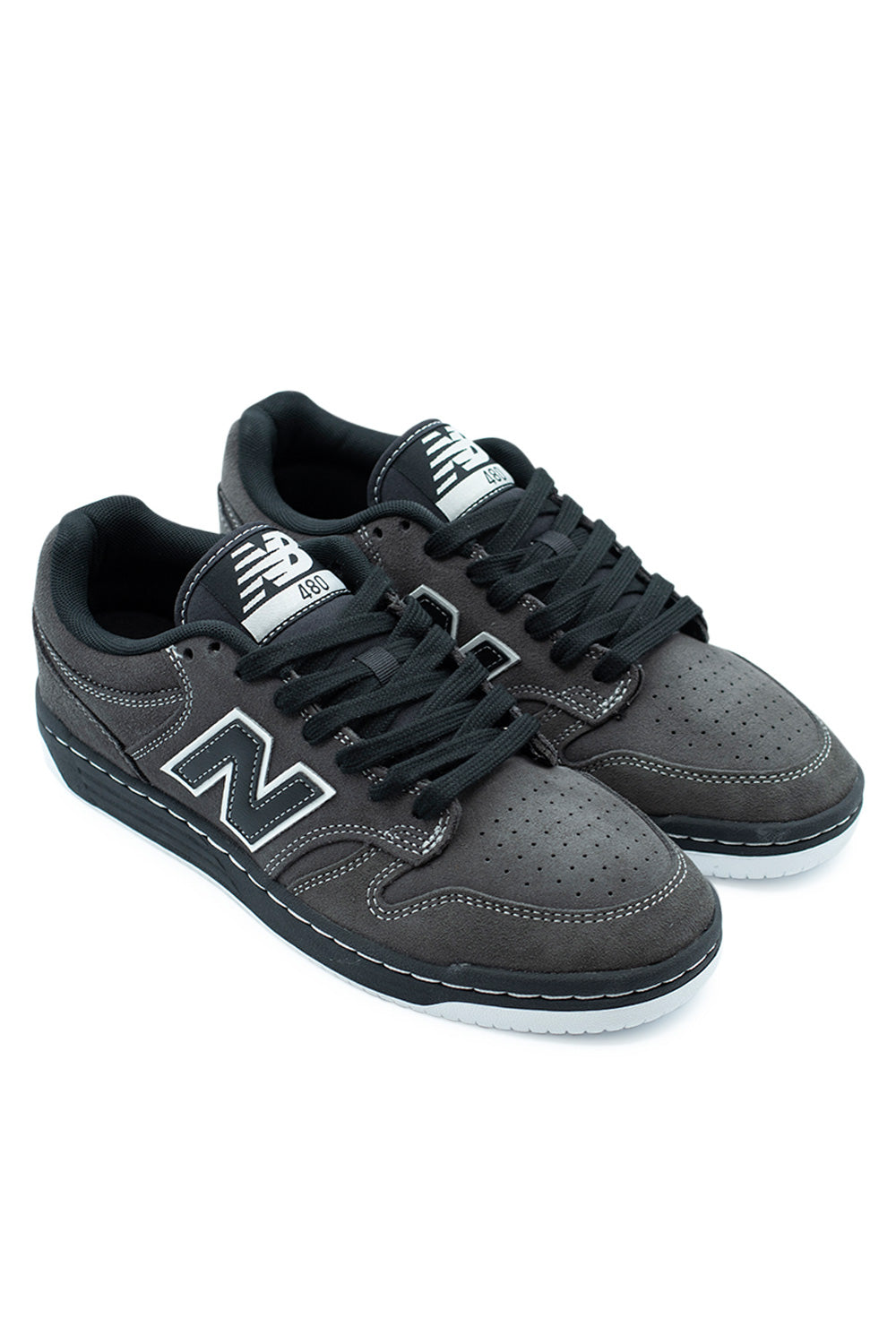 Side view of New Balance Numeric 480 Black Cement White skateboarding shoes featuring suede upper, nylon tongue, and bold leather branding.