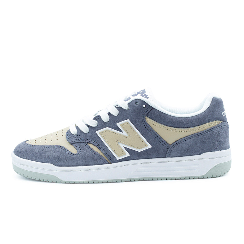 Lateral profile studio view of the New Balance Numeric 480 skate shoe in Meteorite and Incense, showcasing a low-top 1980s basketball-inspired cupsole silhouette featuring dusty grey-blue suede overlays, tan incense full-grain leather side panels, a signature cream N logo with white outline border, white cupsole sidewall with tonal stitching, and a pale grey rubber tread.